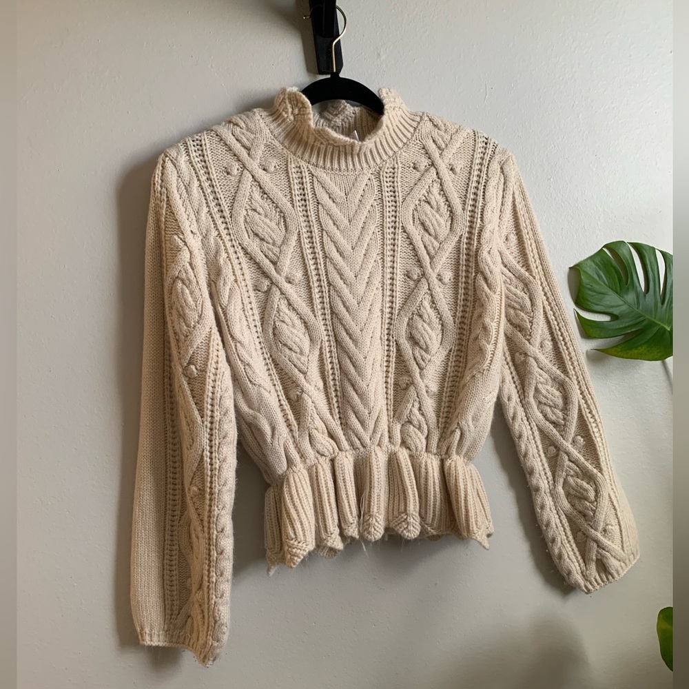 boutique knit sweater with peplum and ruffle detailing